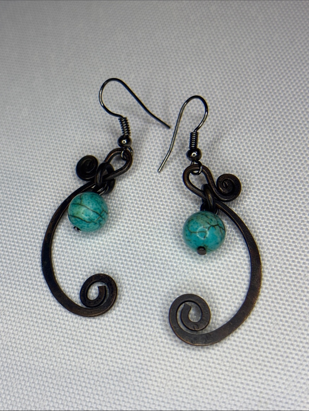 artisan , turquoise gun medal dangling earrings